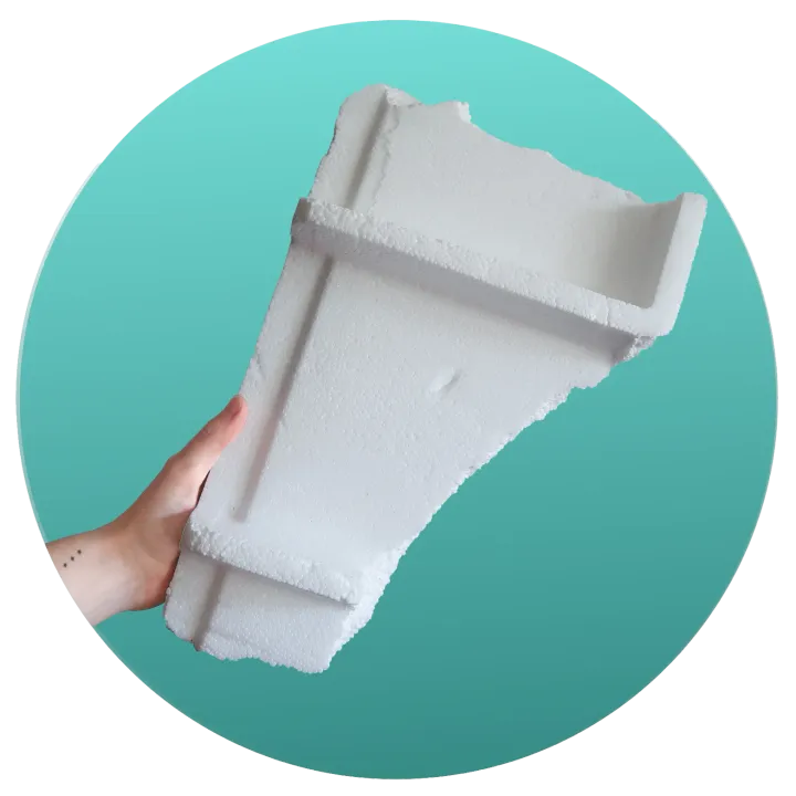 Hand holding a piece of polystyrene