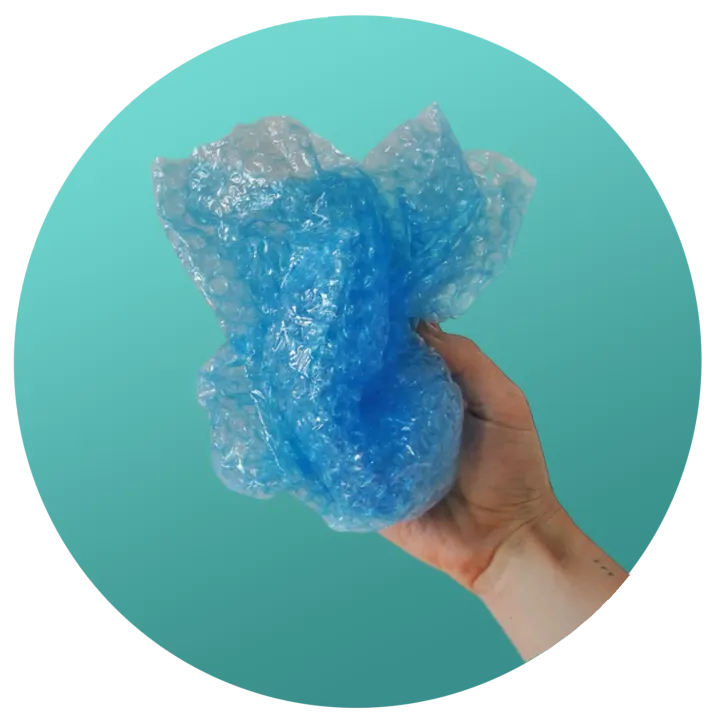 Hand holding scrunched blue soft plastic