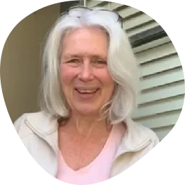 Rachel, a smiling woman with long white hair