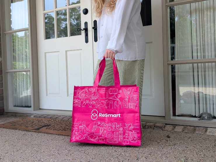 A ReSmart pink bag left at a front door for pickup