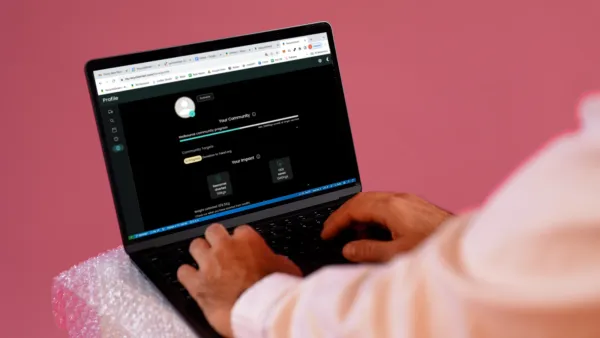 Hands typing on a laptop showing the ReSmart online portal