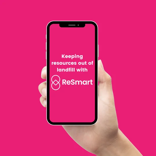 Hand holding a phone showing a ReSmart social media story