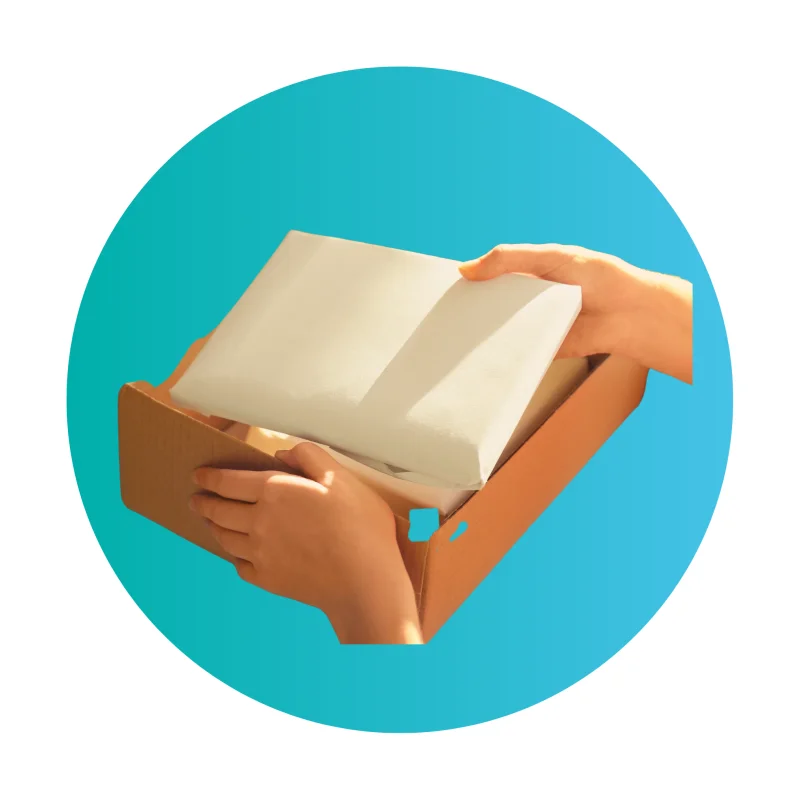 Hands opening a cardboard box of packaging