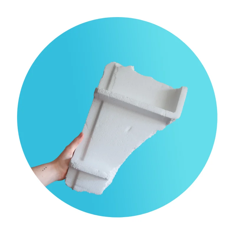 Hand holding a piece of polystyrene packaging